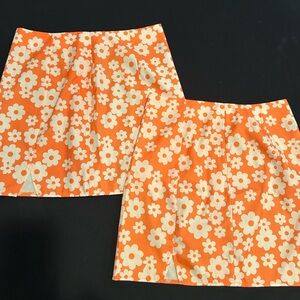 Matching mini skirts, one size M, the other is size L, selling together
